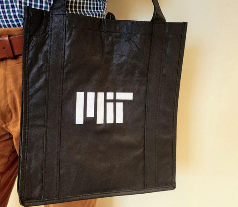 Black tote bag with a white MIT logo
